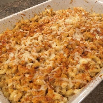 baked homemade macaroni and cheese recipe with paprika in white baking dish