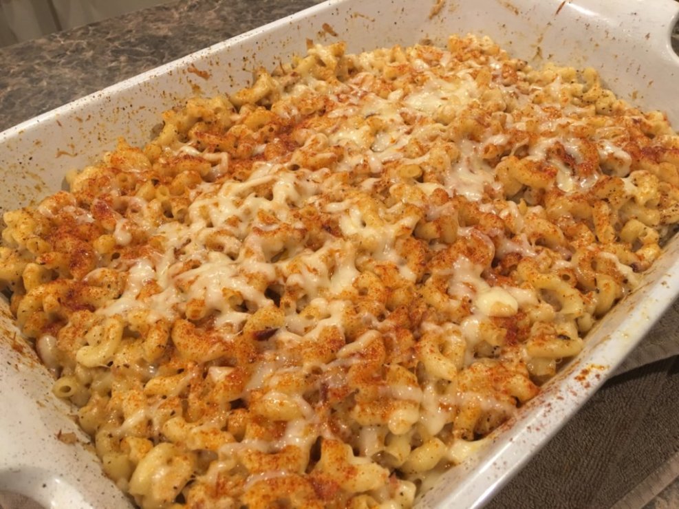 baked homemade delicious macaroni and cheese recipe with paprika in white baking dish