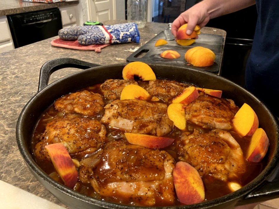 Place the fresh sliced peaches around the browned chicken within the peach barbeque sauce.