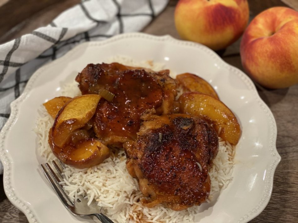BBQ chicken, fresh baked peaches, peach barbeque sauce served over a bed of white rice. 