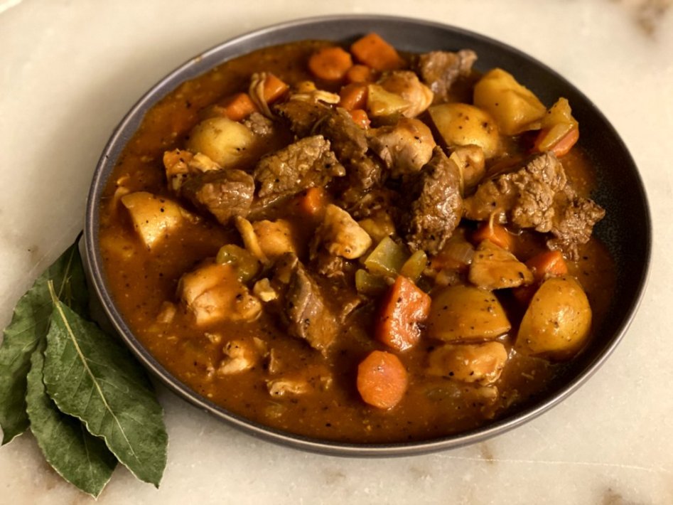 Coogan's Chicken & Beef Irish Stew with carrots, potatoes, and celery. Sprinkled with lots of Irish seasoning blends. 