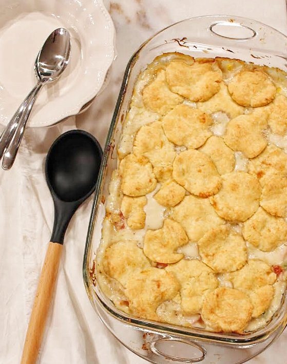 vintage ham casserole or ham pie is a delicioius and easy recipe full of creamy ham, vegetables, and a top layer of cayenne cheddar biscuits. 