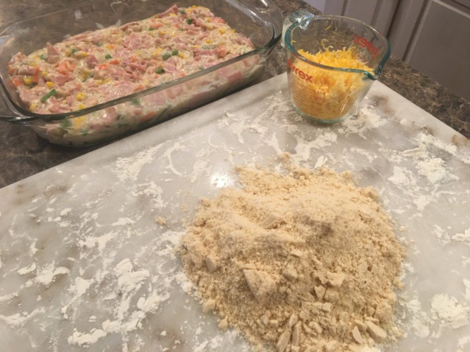 place the biscuit mix on a cold and floured surface to combine and mix with the shredded cheddar cheese. 