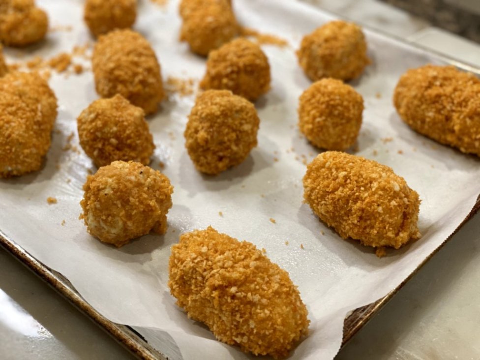 Cheesy Chicken Baked Croquettes wrapped in panko bread crumbs ready to bake in the oven
