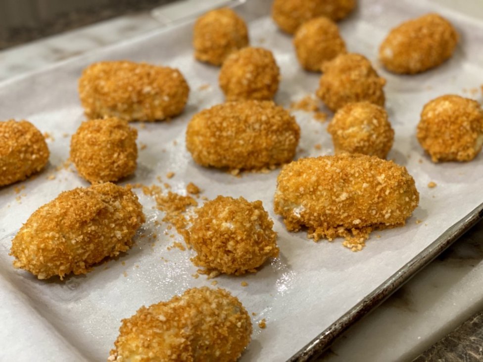 Cheesy Chicken Baked Croquettes wrapped in panko bread crumbs ready to bake in the oven