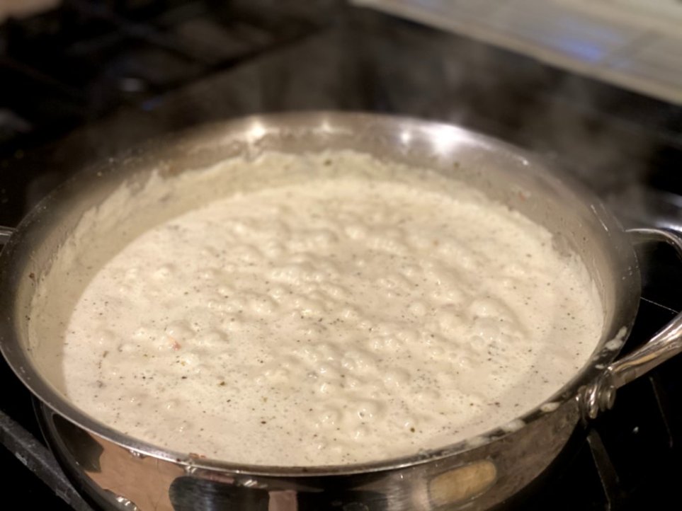 creamy sauce bubbling over medium heat. 