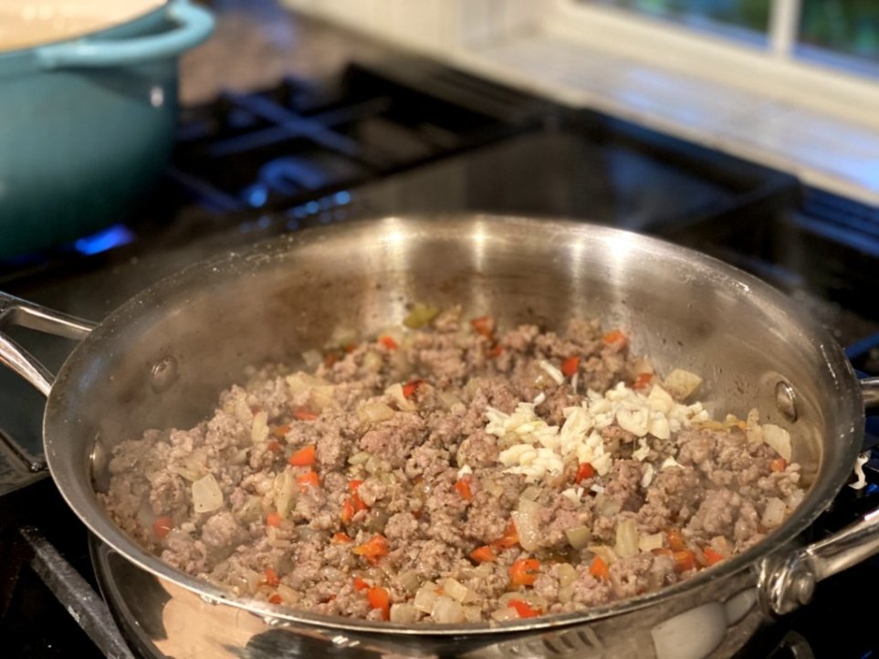 adding garlic to the recipe