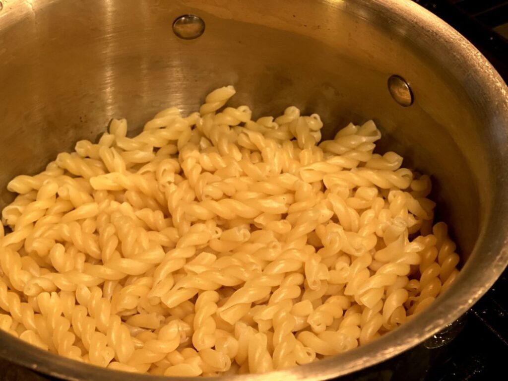 cooking pasta in a stainless steel pot