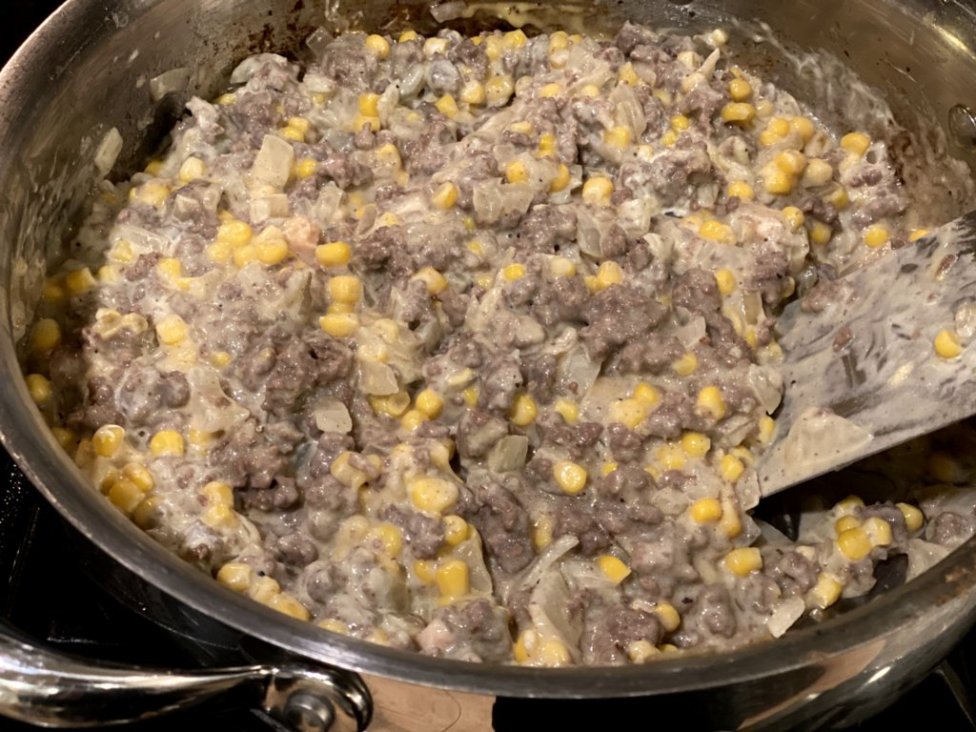 cooked ground beef with corn, sour cream, milk, cream of chicken soup  in a large skillet. 