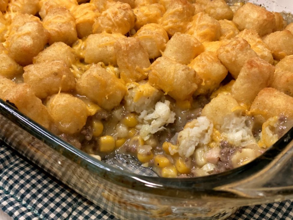 tater tot casserole in a glass baking dish