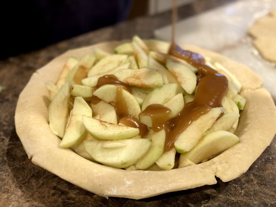 sugar and brown sugar heated and poured over green apples to create a delicious apple pie. 