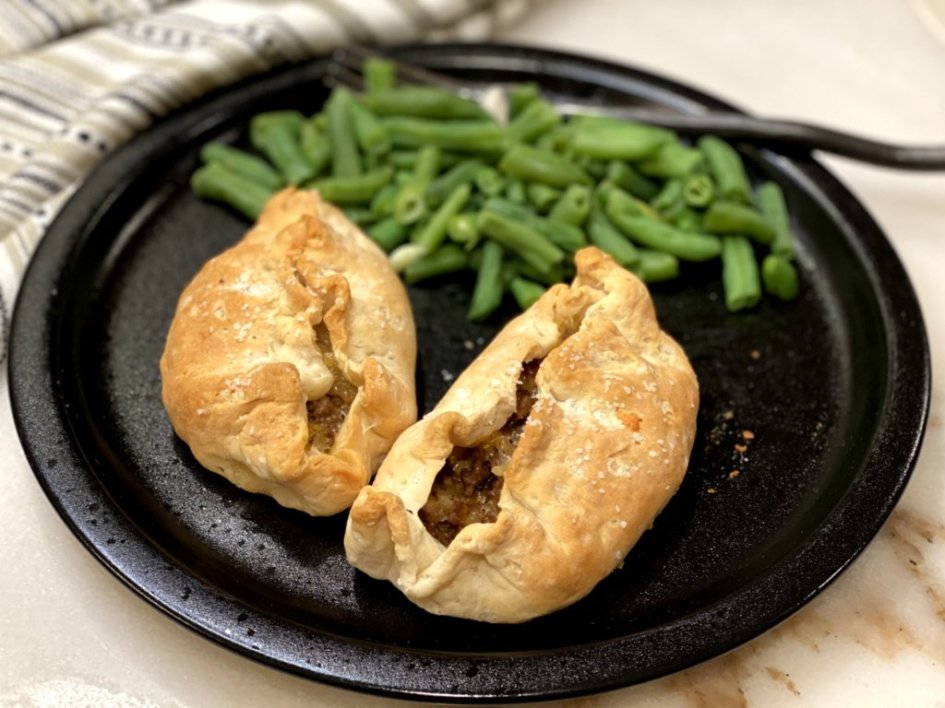 Irish Cheddar and potato Meat Pies are ready to serve with a side of green beans