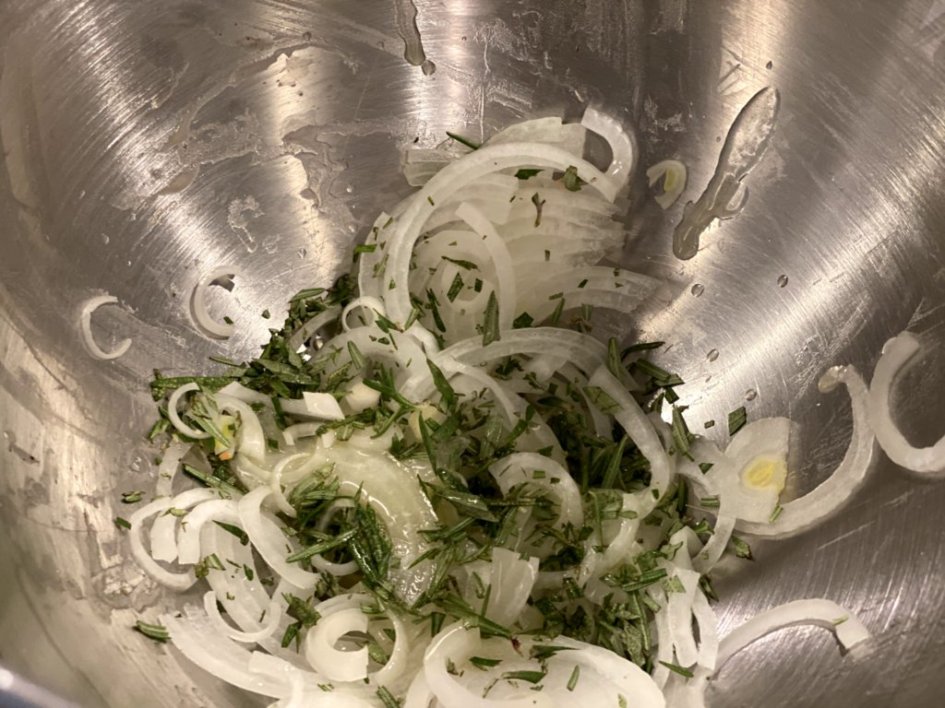 a mix of sliced onions and chopped rosemary