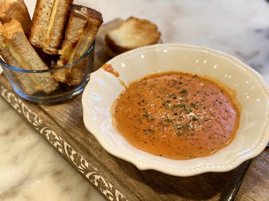 creamy tomato bisque soup recipe served with Toasted Grilled Cheese Dipping Sticks on the side. 