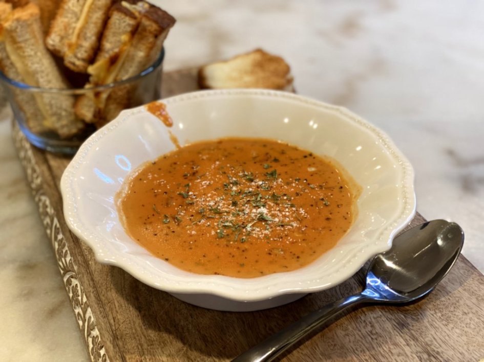 creamy tomato bisque soup recipe served with Toasted Grilled Cheese Dipping Sticks on the side. 