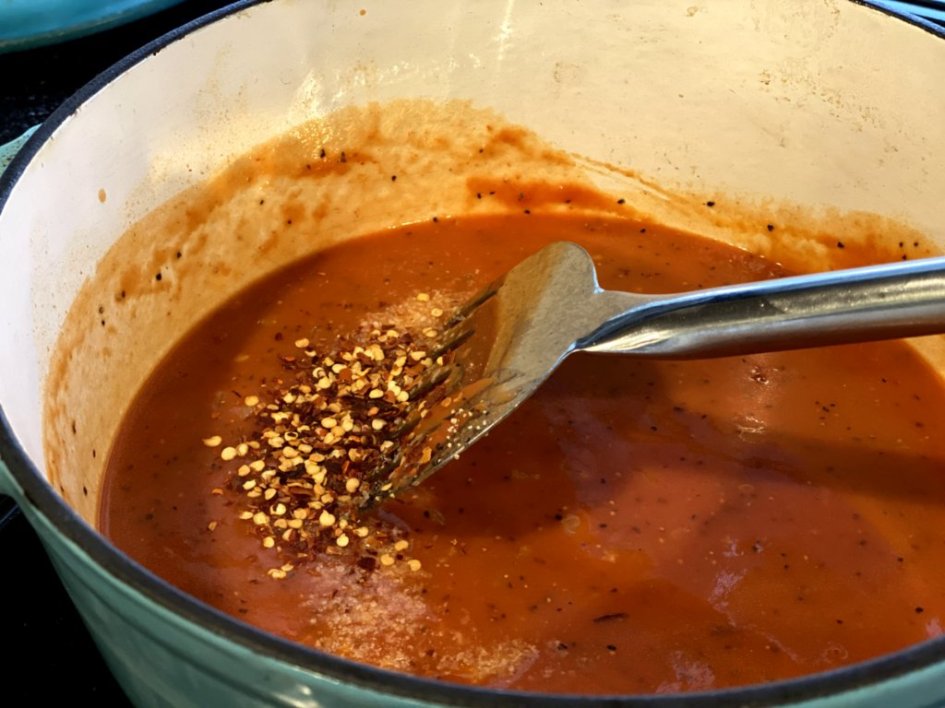 red pepper flakes are stirred in 