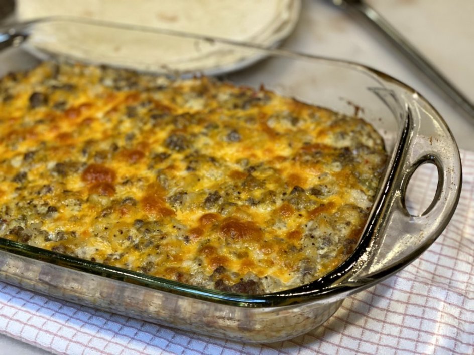 hamburger hashbrown casserole ready to serve with tortillas on the side