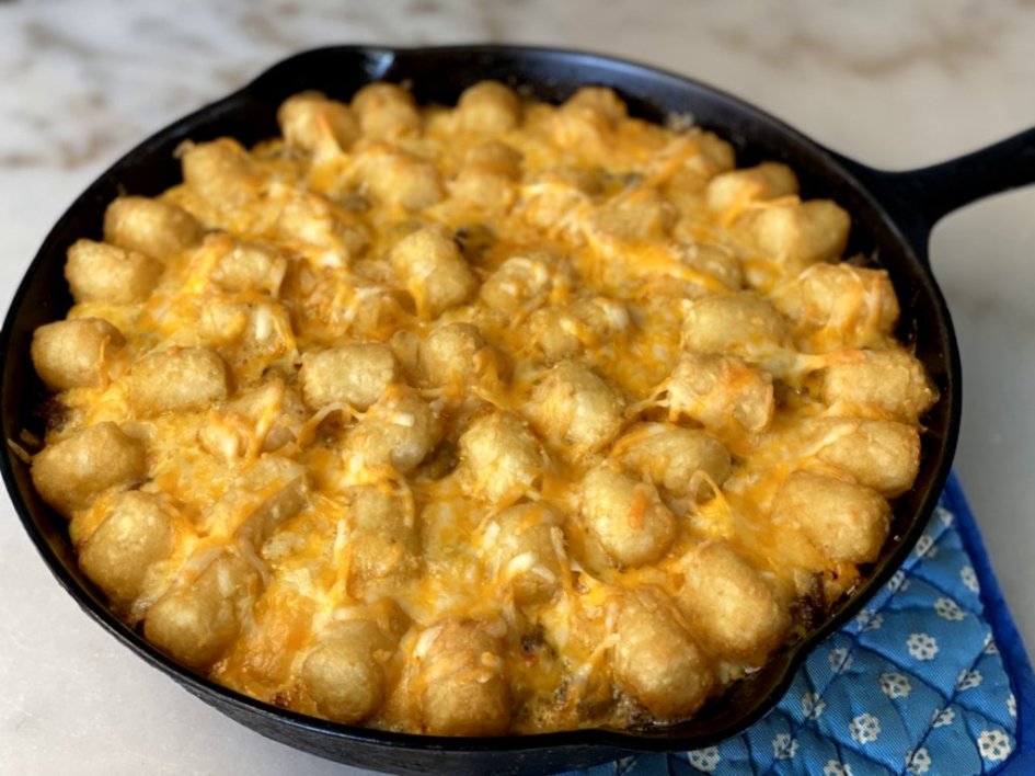 tater tot and sausage breakfast casserole recipe made with ground sausage, cheddar cheese, tater tots, onions, and peppers