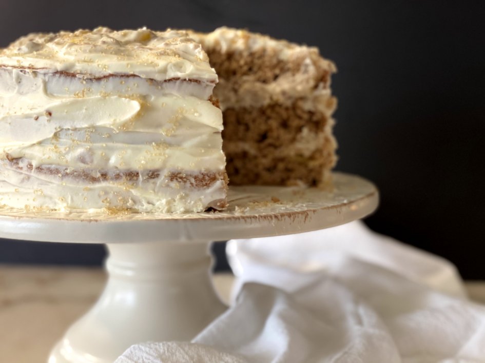 Hummingbird cake with one slice removed. 