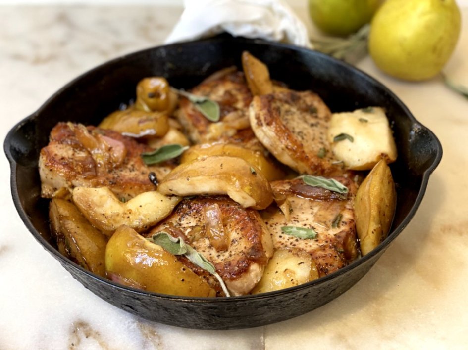 Roasted Pears and Pork Chops with a maple syrup glaze baked in a cast-iron skillet from coogan's kitchen.