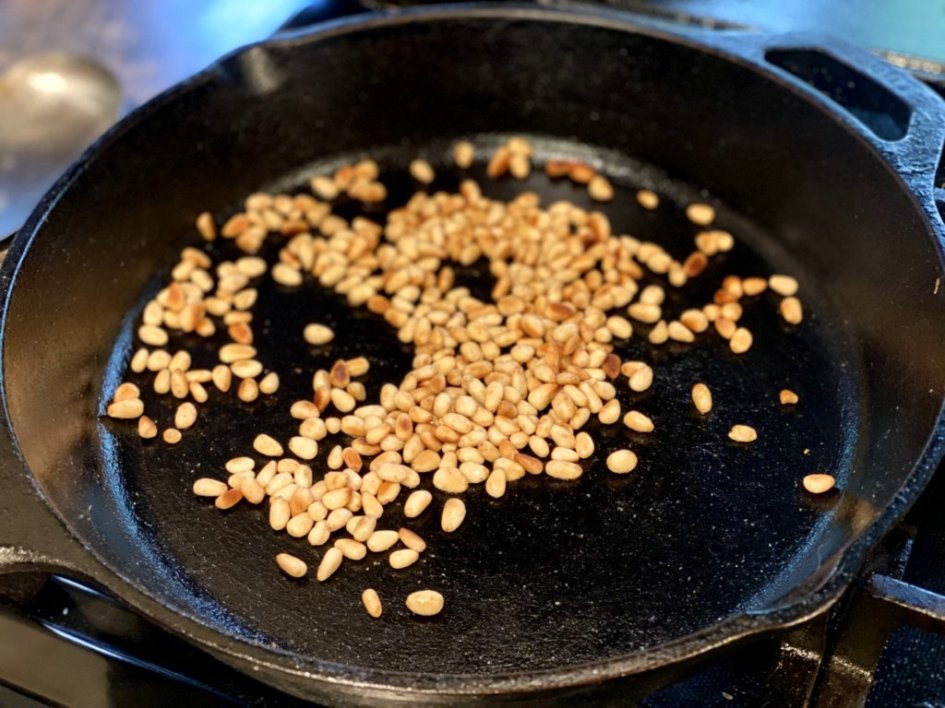 toasting pine nuts in butter in a cast-iron skillet. 