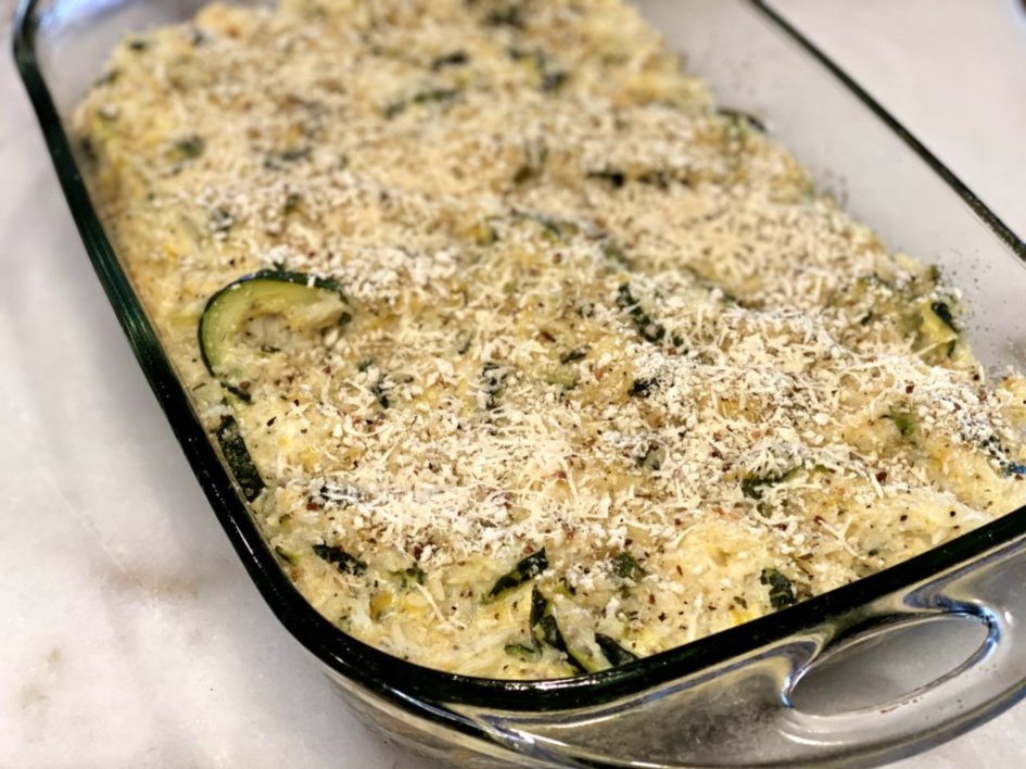 Additional parmesan cheese and crunchy panko bread crumbs are sprinkled on the top of the zucchini rice casserole prior to baking. cheesy zucchini rice casserole recipe