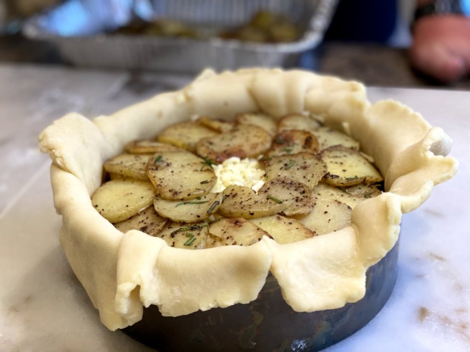 browned potatoes added to the meat and cheese pie. 