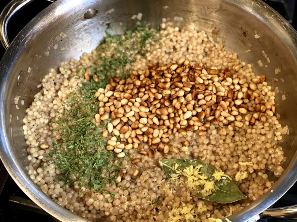 Tossing in herbs, spices, and lemon zest to the cooking couscous. 