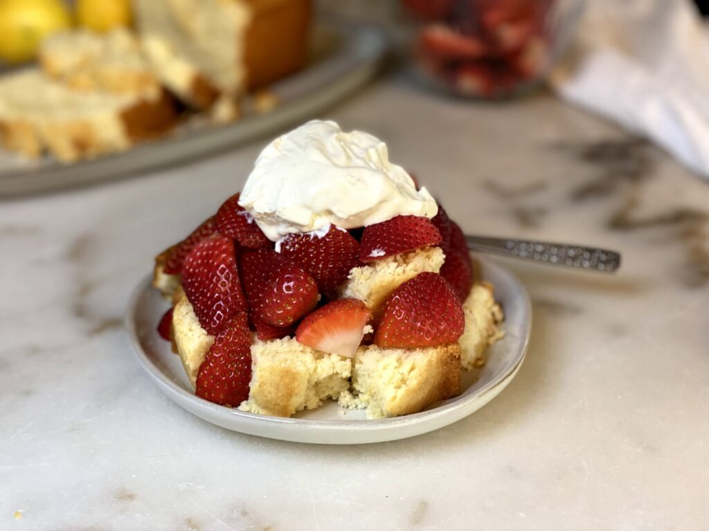 delicious lemon pound cake recipe with strawberries and made from scratch whipped cream