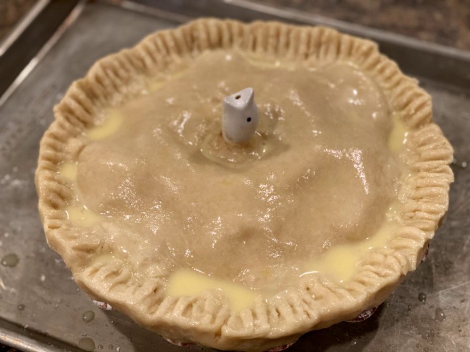 brushing an egg wash over the top of the pie crush before baking. 