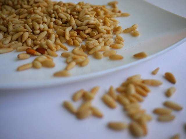 Pine nuts on a plate ready to be toasted. 