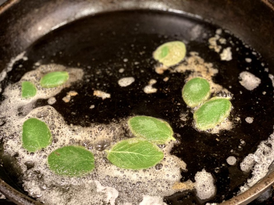frying sage leaves and garlic in butter and olive oil in a cast-iron skillet