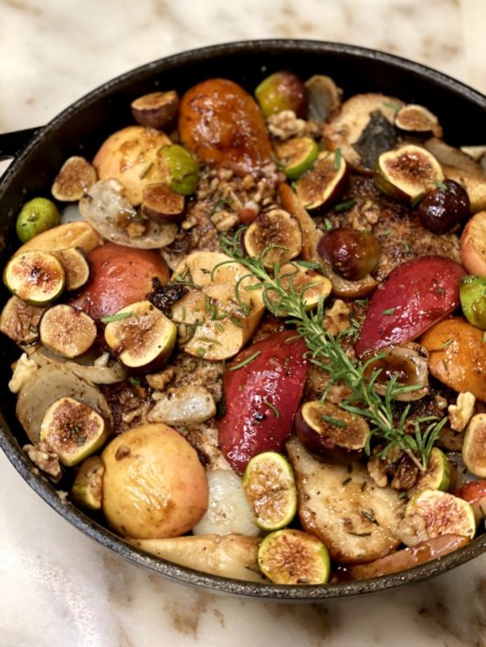 Pork Chops with Maple Glazed Figs, Pears, & Apples Coogan's Kitchen in a cast iron skillet ready to serve