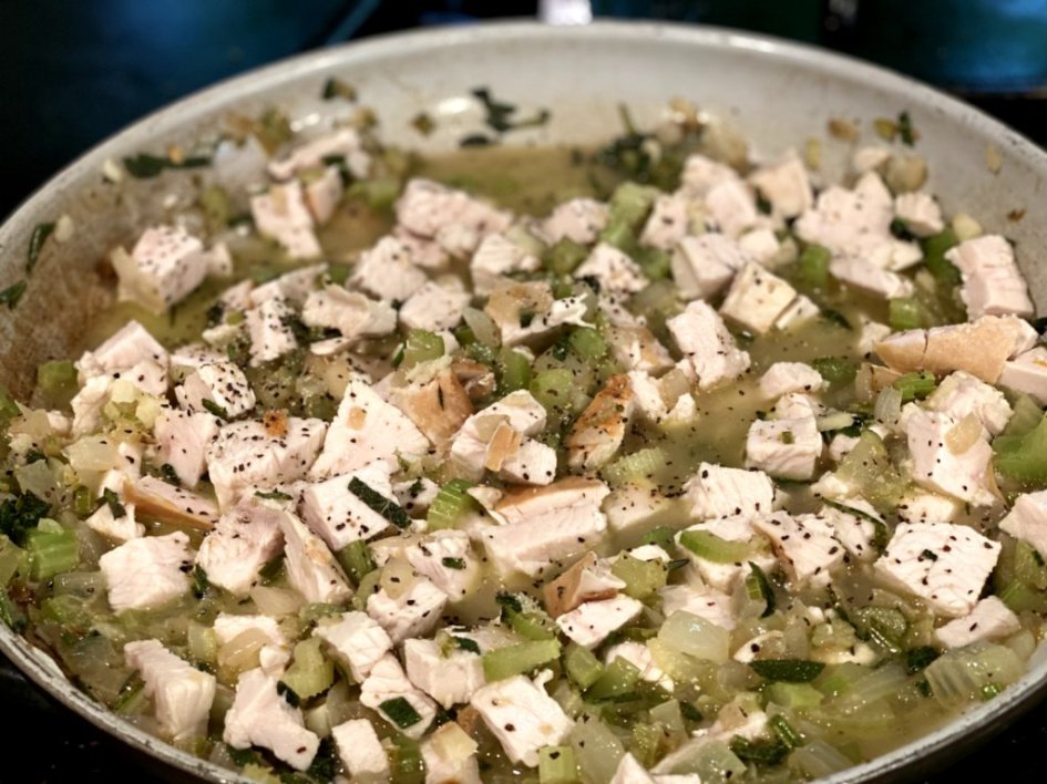 add turkey and broth to the skillet with the vegetables and herbs. 