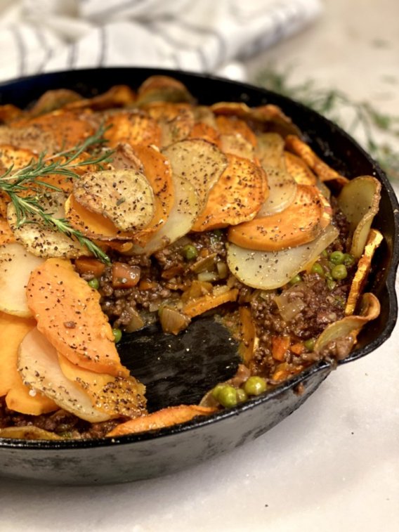 An inside view of Cottage Pie Potato Galette with layers of meat and vegetables and gravy. 