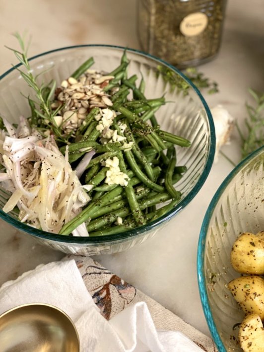 green beans and shallots in a glass bowls
