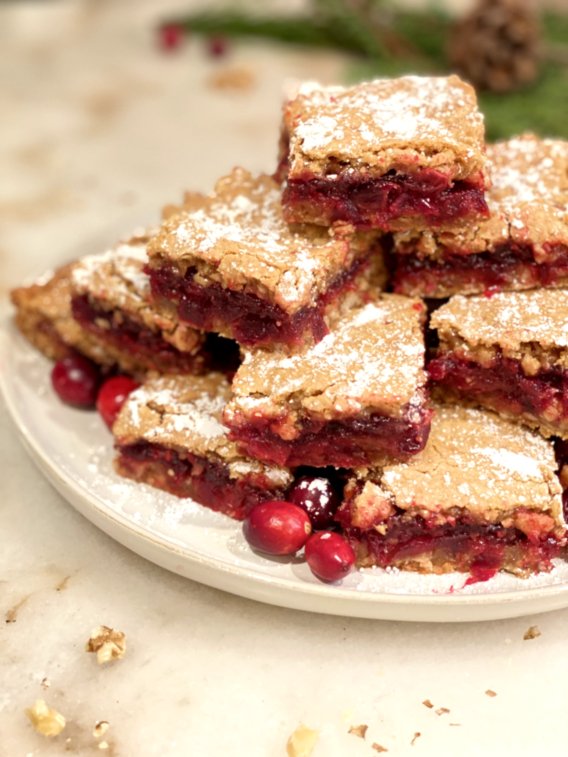 Cut cranberry bars bright red and sprinkled with powdered sugar.