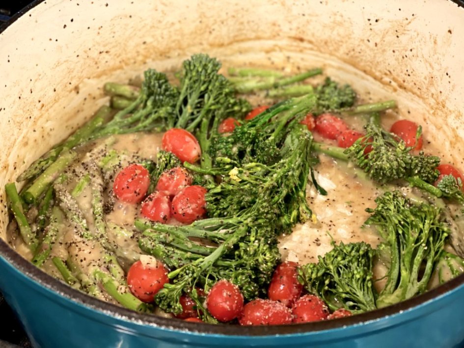broccolini, asparagus, tomatoes, cooking in a garlic, parmesan cream sauce. 